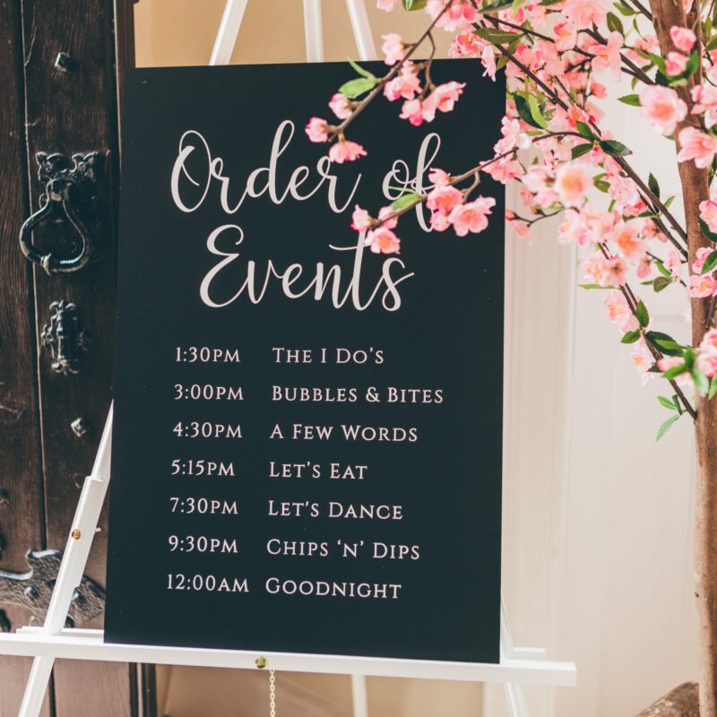 Monochrome chalkboard wedding signage order of events