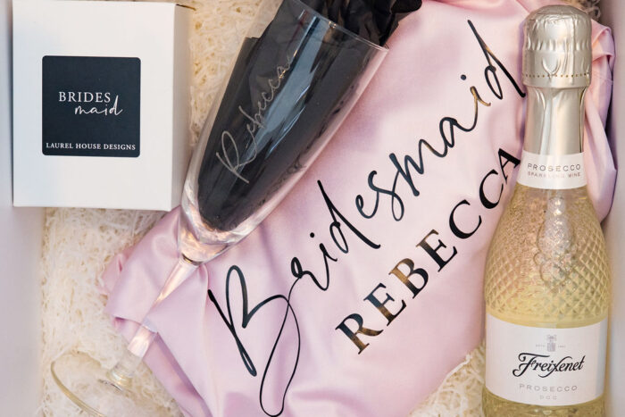 The ultimate bridal party gift box including chocolate, prosecco and a personalised satin robe