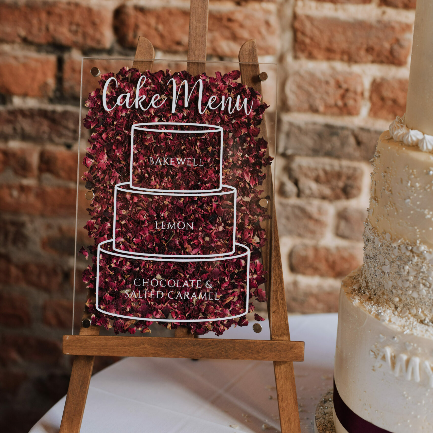 Confetti filled acrylic wedding signage cake menu