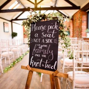 Chalkboard pick a seat wedding sign