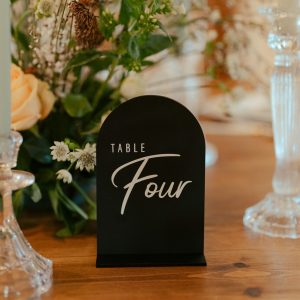 Black and white shaped acrylic wedding table name