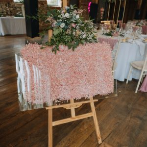 Pink confetti filled acrylic wedding table plan