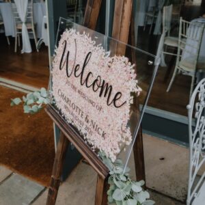 Flower filled wedding welcome sign